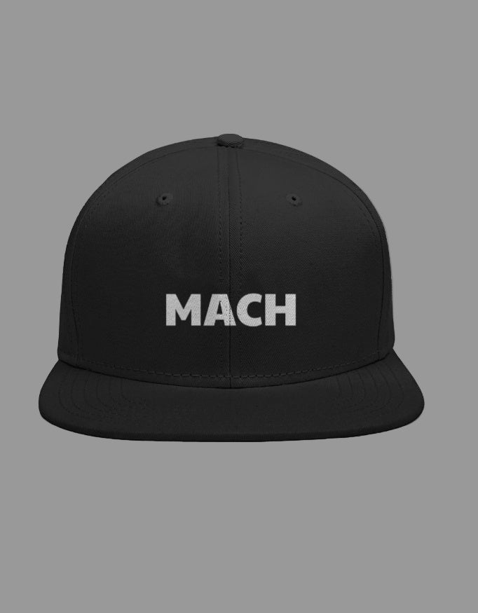 Black cap with 'MACH' text on a gray background