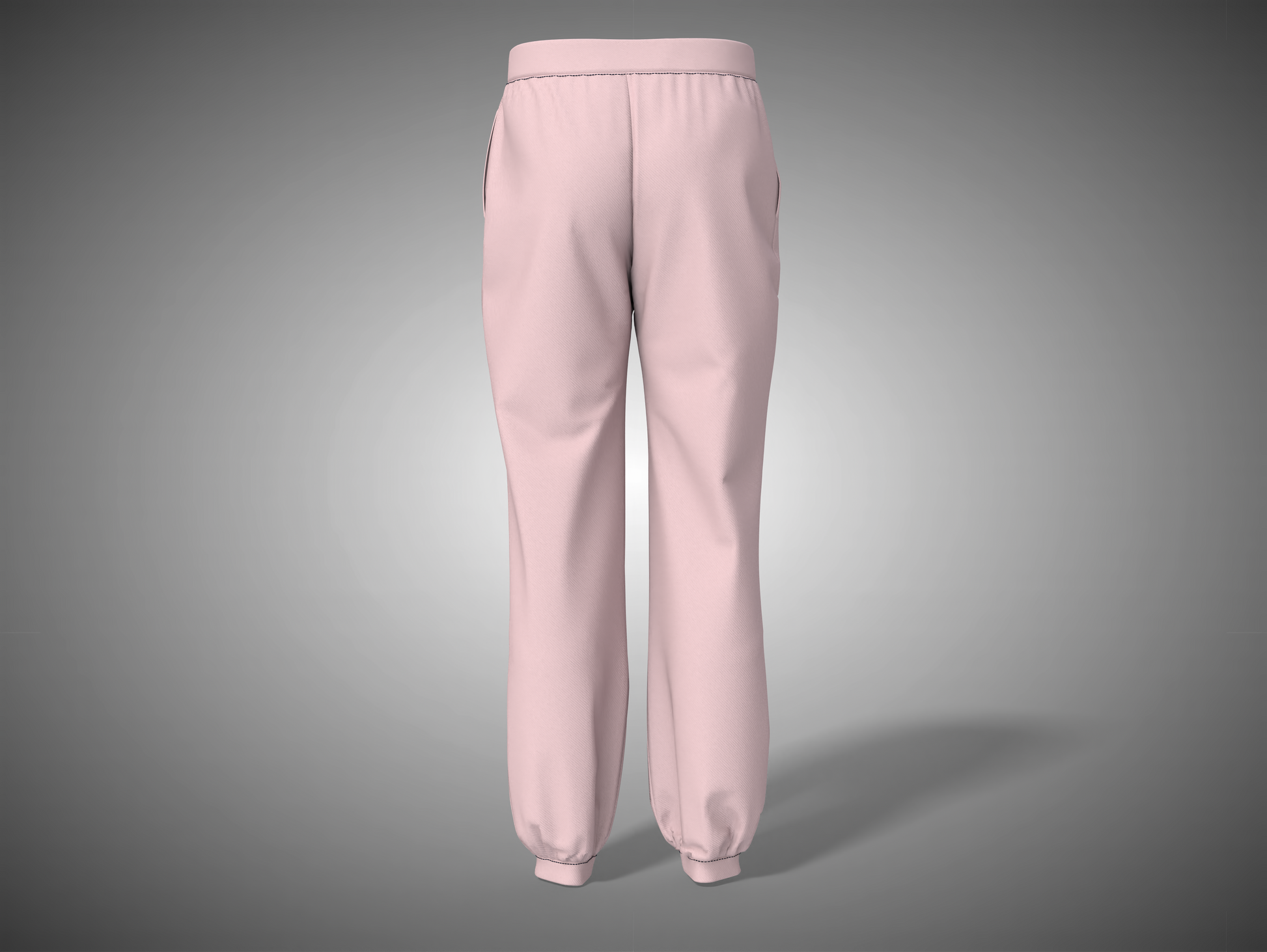 Baby pink sweatpants on a gray background