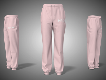 Baby pink sweatpants with 'MACK' branding on a gray background