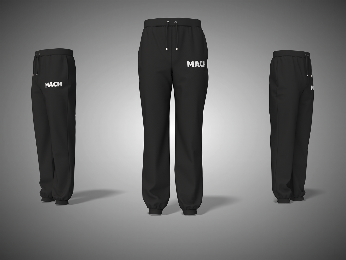 Black pants with 'MACH' branding on a gray background