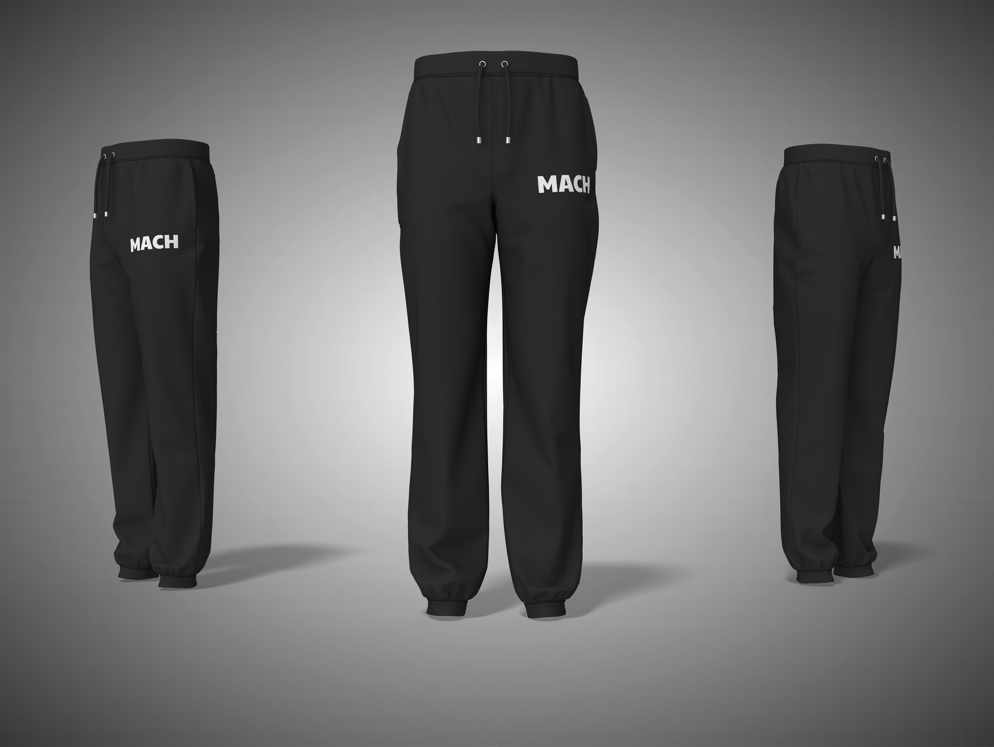 Black pants with 'MACH' branding on a gray background