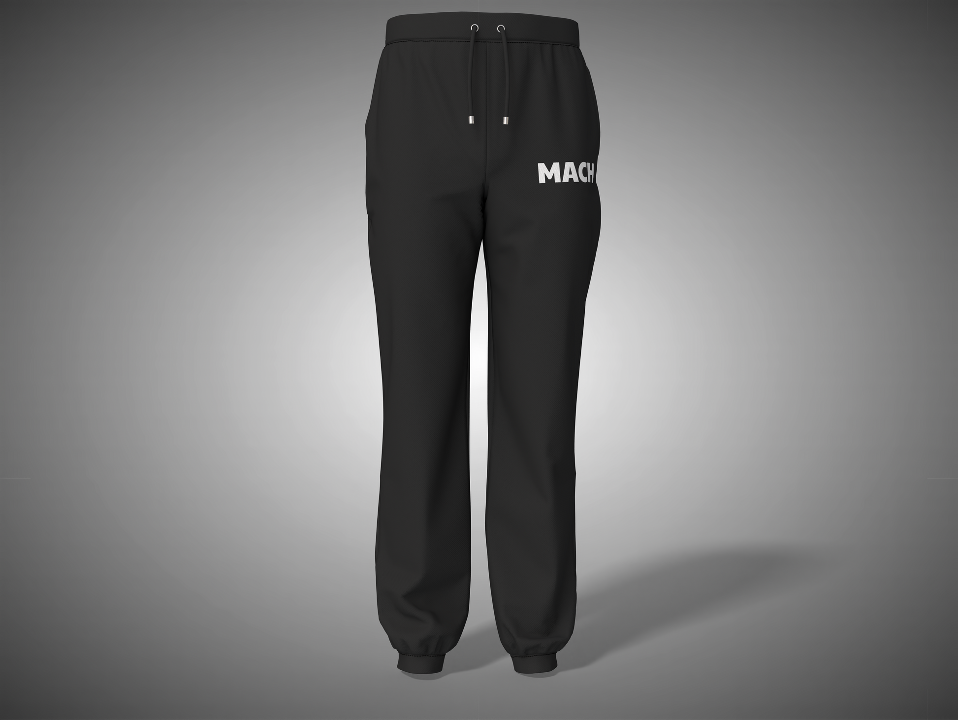 Black pants with 'MACK' branding on a gray background