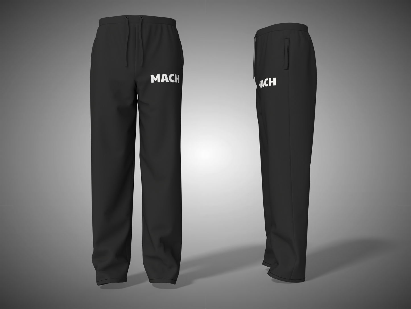 Black pants with 'MACH' branding on a gray background