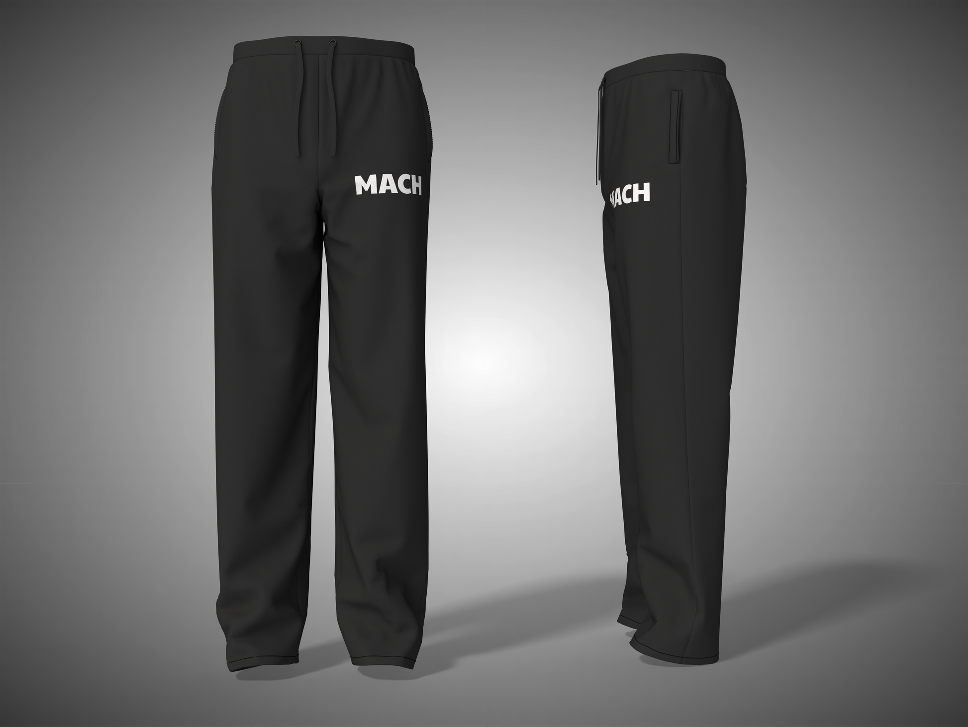 Black pants with 'MACH' branding on a gray background