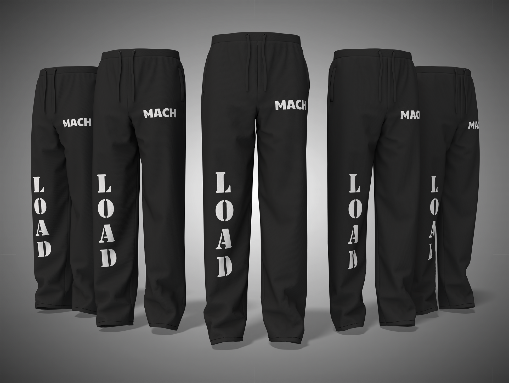 Black pants with 'MACH' and 'LOAD' text on a gray background