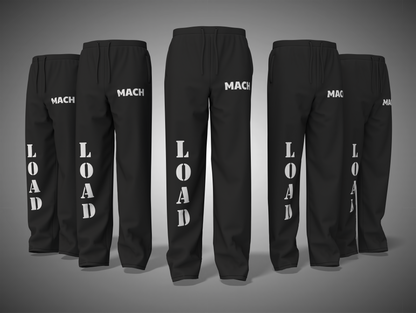 Black pants with 'MACH' and 'LOAD' text on a gray background