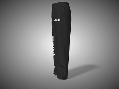 Black sweatpants with white text on a gray background