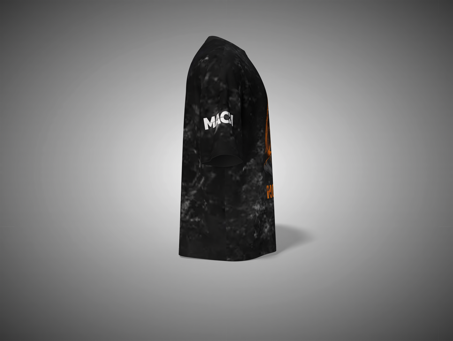 Black and orange patterned t shirt with 'MAC' branding on a gray background