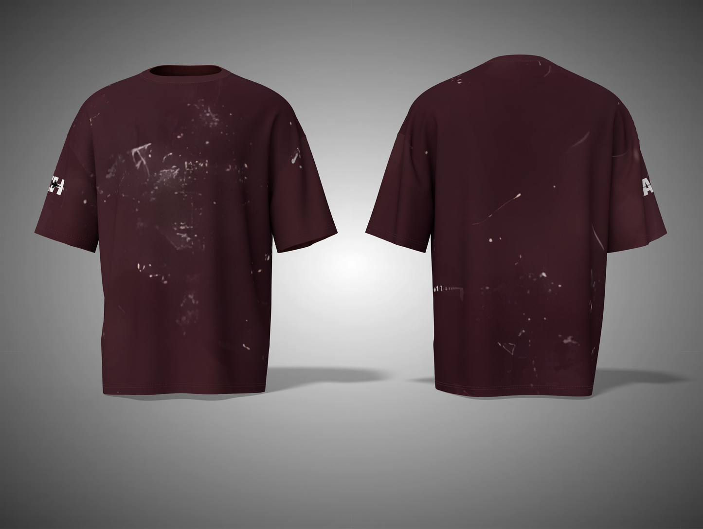 Maroon t-shirt with splatter design on a gray background