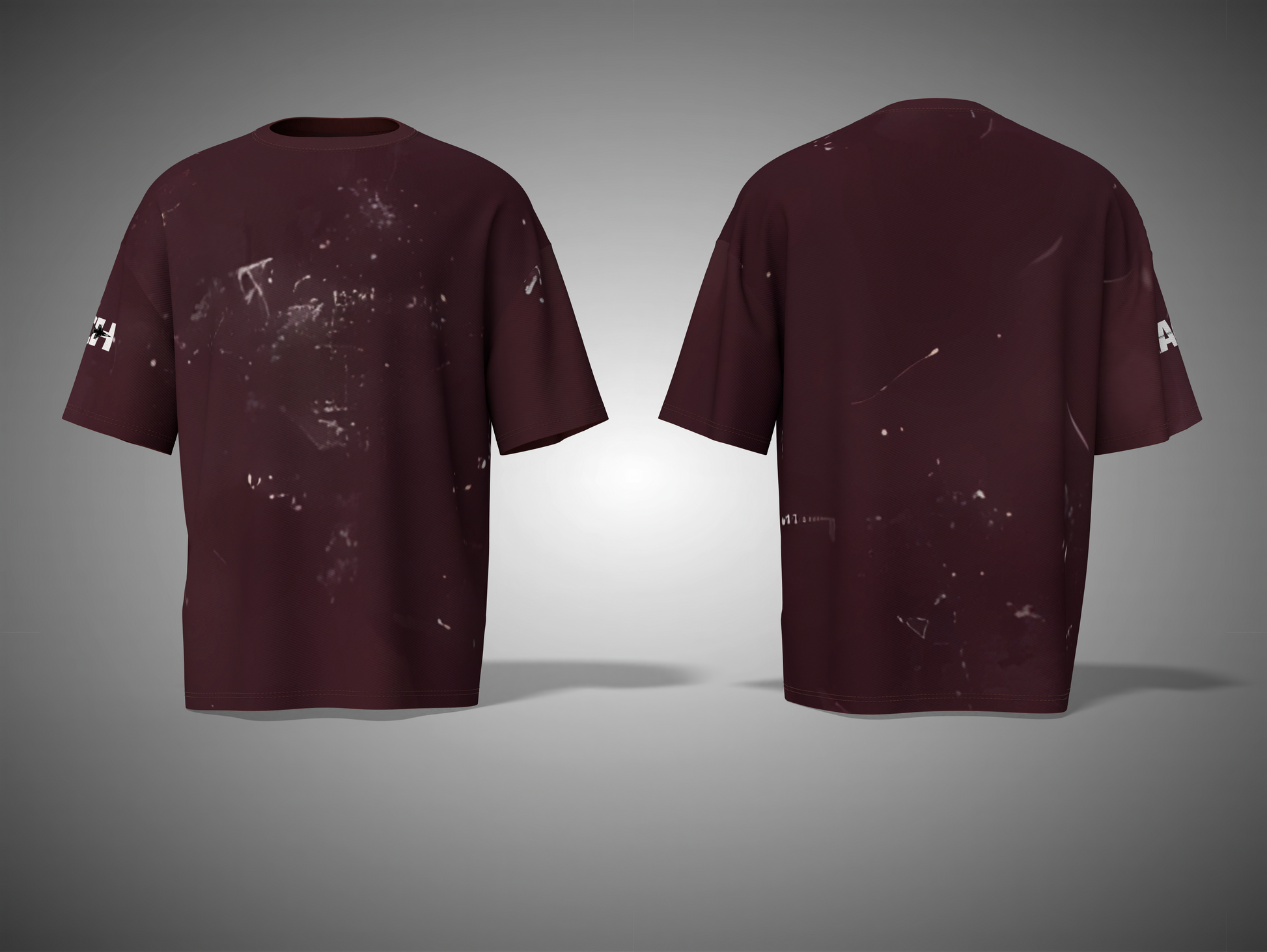 Maroon t-shirt with splatter design on a gray background