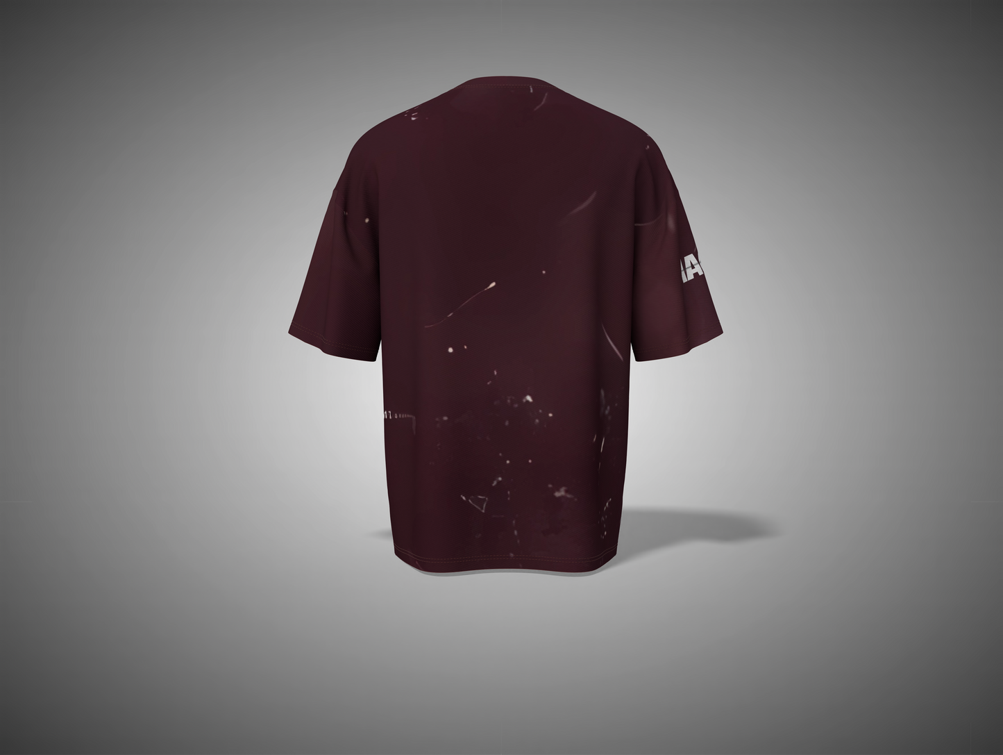 Maroon t-shirt with a small logo on the sleeve against a gray background