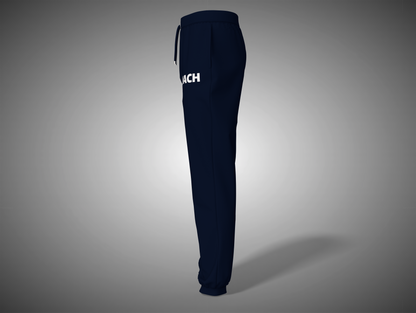 Navy blue sweatpants with a brand logo on a gray background