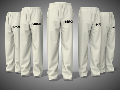 Set off white sweatpants with 'MACH' branding on a gray background