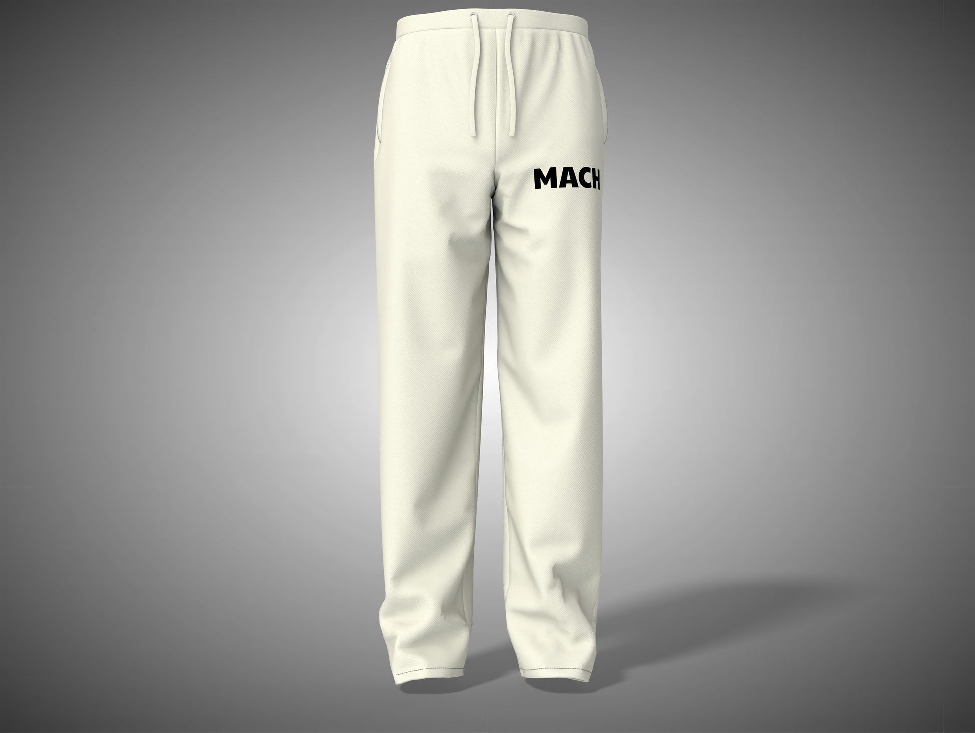 White sweatpants with 'MACH' branding on a gray background