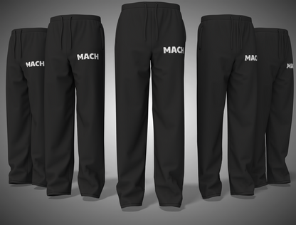 Black pants with 'MACH' branding on a gray background
